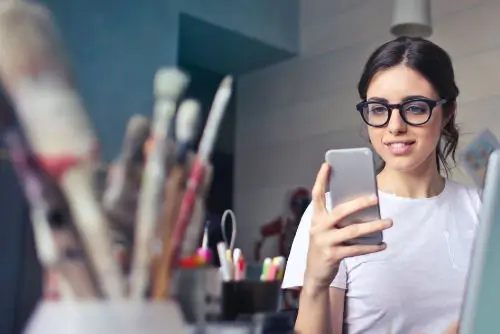 girl on phone in design studio
